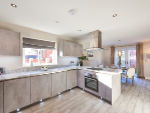 Contemporary dining kitchen with integrated appliances