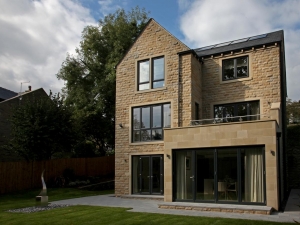 Rear of home showing bi-fold doors from dining room into garden.