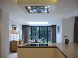View from kitchen looking into dining area and bi-fold doors opening onto garden.